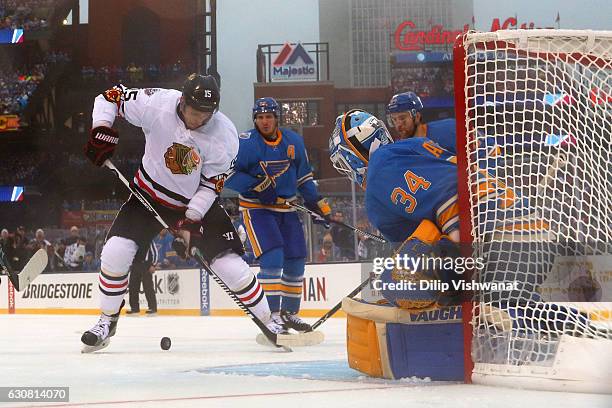 Artem Anisimov of the Chicago Blackhawks looks to take a shot against Jake Allen of the St. Louis Blues during the 2017 Bridgestone NHL Winter...