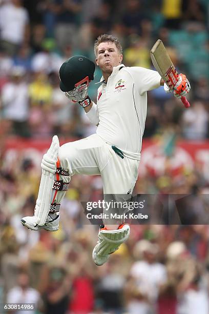 David Warner of Australia celebrates his century during day one of the Third Test match between Australia and Pakistan at Sydney Cricket Ground on...