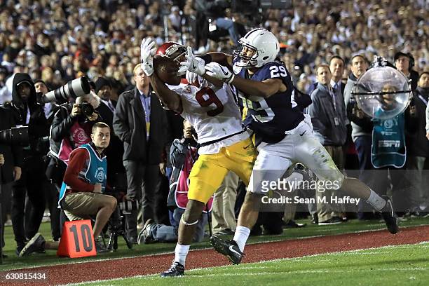 Wide receiver JuJu Smith-Schuster of the USC Trojans makes a 22-yard catch against cornerback John Reid of the Penn State Nittany Lions in the fourth...