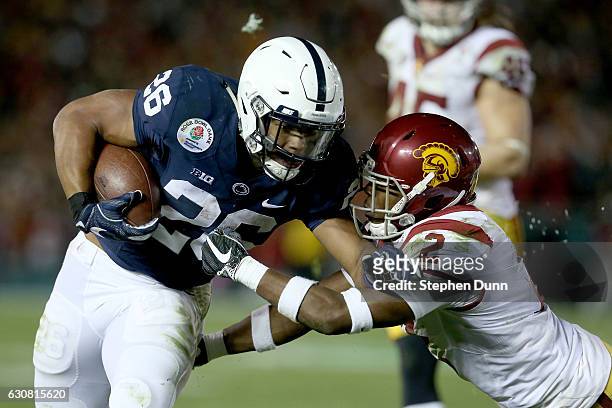 Running back Saquon Barkley of the Penn State Nittany Lions carries the ball against defensive back Adoree' Jackson of the USC Trojans in the second...