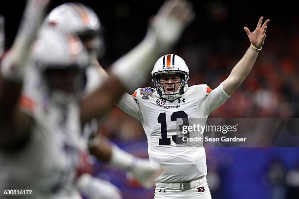 Sean White of the Auburn Tigers reacts after a touchdown against the Oklahoma Sooners during the Allstate Sugar Bowl at the Mercedes-Benz Superdome...