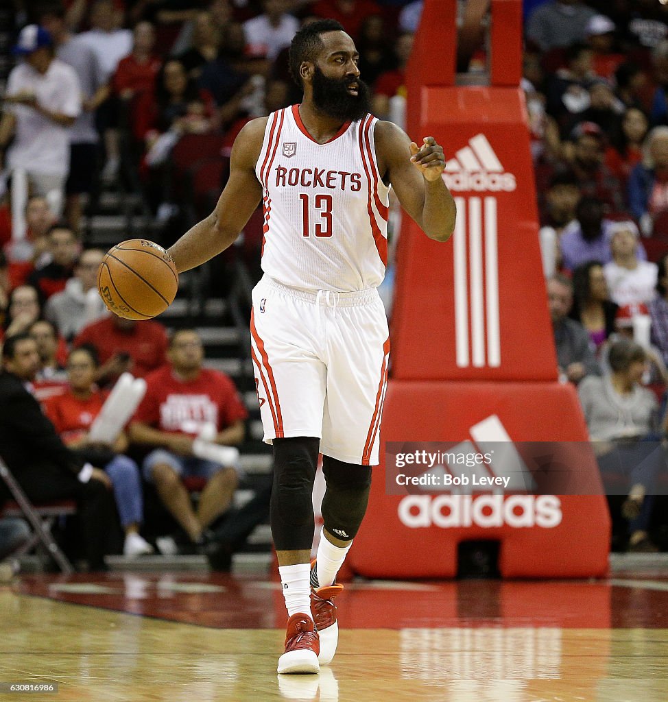 Harden Rockets James Harden of the Houston Rockets brings the ball up the court ...