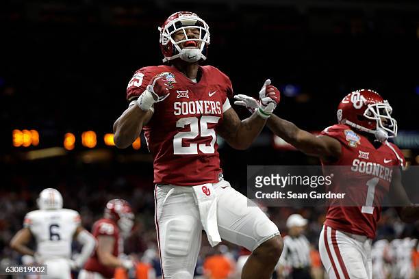 Joe Mixon of the Oklahoma Sooners reacts after scoring a touchdown against the Auburn Tigers during the Allstate Sugar Bowl at the Mercedes-Benz...