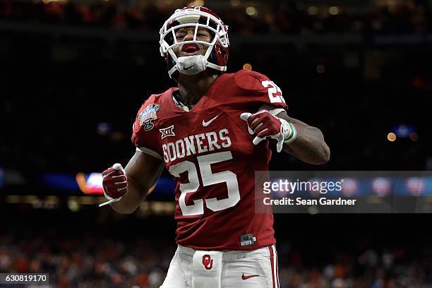 Joe Mixon of the Oklahoma Sooners reacts after scoring a touchdown against the Auburn Tigers during the Allstate Sugar Bowl at the Mercedes-Benz...