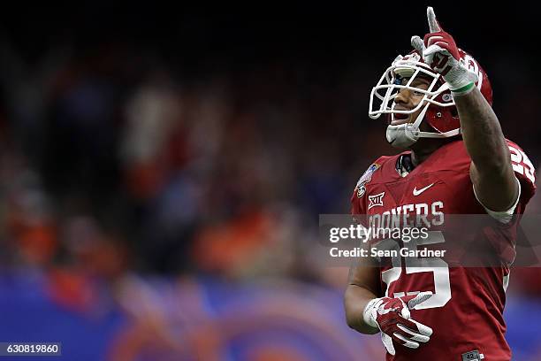 Joe Mixon of the Oklahoma Sooners reacts after a touchdown against the Auburn Tigers during the Allstate Sugar Bowl at the Mercedes-Benz Superdome on...