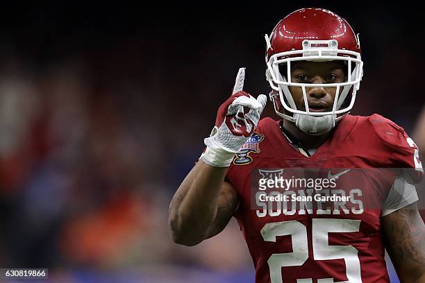Joe Mixon of the Oklahoma Sooners reacts after a touchdown against the Auburn Tigers during the Allstate Sugar Bowl at the Mercedes-Benz Superdome on...