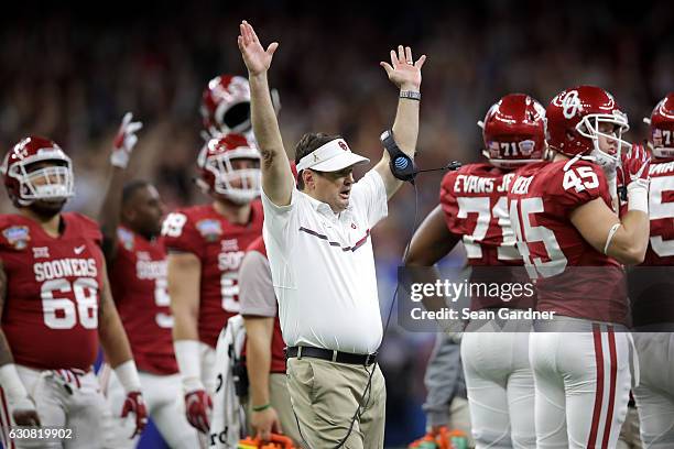 Head coach Bob Stoops of the Oklahoma Sooners reacts after a touchdown against the Auburn Tigers during the Allstate Sugar Bowl at the Mercedes-Benz...
