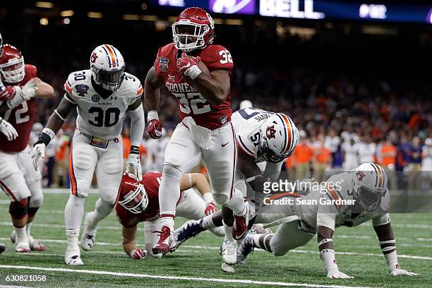 Samaje Perine of the Oklahoma Sooners reacts after scoring a touchdown against the Auburn Tigers during the Allstate Sugar Bowl at the Mercedes-Benz...