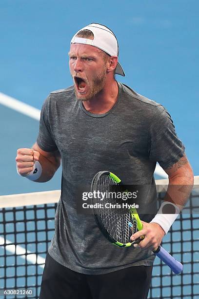 Sam Groth of Australia celebrates a point during his match against Pierre-Hughes Herbert of France on day three of the 2017 Brisbane International at...