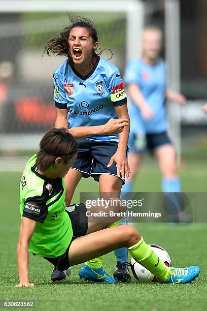 Teresa Polias of Sydney is tackled by Yukari Kinga of Canberra during the round 10 W-League match between Sydney and Canberra at Lambert Park on...