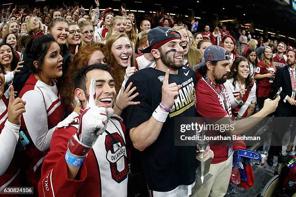 Baker Mayfield of the Oklahoma Sooners celebrates after defeating the Auburn Tigers 35-19 during the Allstate Sugar Bowl at the Mercedes-Benz...