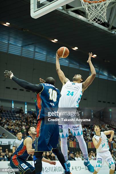 Lawrence Hill of the Kyoto Hannaryz contests a rebound with Faye Pape Mour of the Yokohama B-Corsairs during the B. League game between Yokohama...