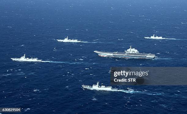 This aerial photo taken on January 2, 2017 shows a Chinese navy formation, including the aircraft carrier Liaoning , during military drills in the...