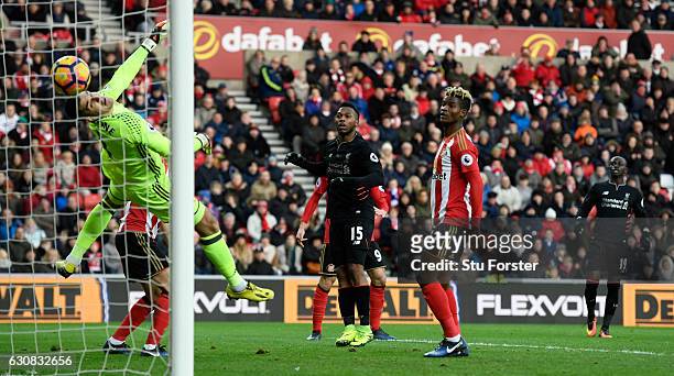 Sunderland goalkeeper Vito Mannone is beaten by a header from Liverpool player Daniel Sturridge for the opening Liverpool goal during the Premier...