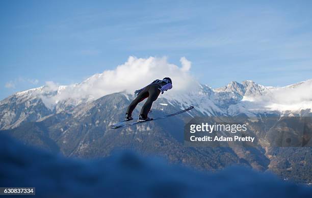 Jan Matura of Czech Republic soars through the air during his qualification jump on Day 1 of the 65th Four Hills Tournament ski jumping event on...