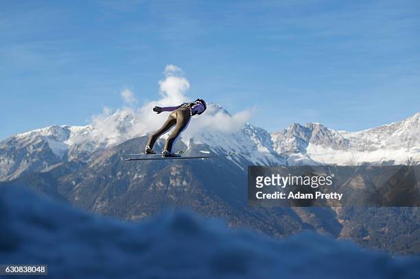 Lukas Hlava of Czech Republic soars through the air during his qualification jump on Day 1 of the 65th Four Hills Tournament ski jumping event on...