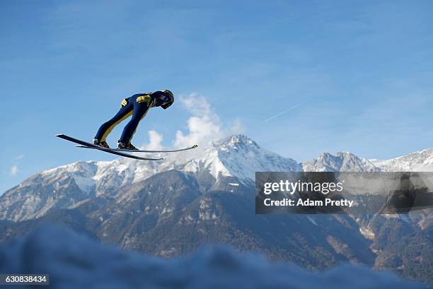 Noriaki Kasai of Japan soars through the air during his qualification jump on Day 1 of the 65th Four Hills Tournament ski jumping event on January 3,...