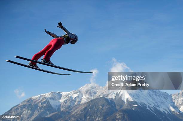 Anders Fannemel of Norway soars through the air during his qualification jump on Day 1 of the 65th Four Hills Tournament ski jumping event on January...