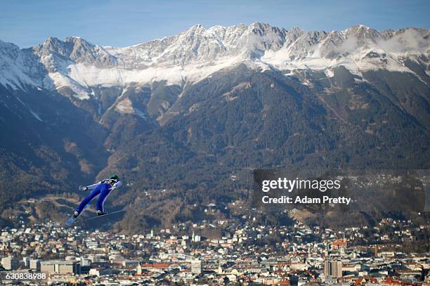 Peter Prevc of Slovenia soars through the air during his qualification jump on Day 1 of the 65th Four Hills Tournament ski jumping event on January...