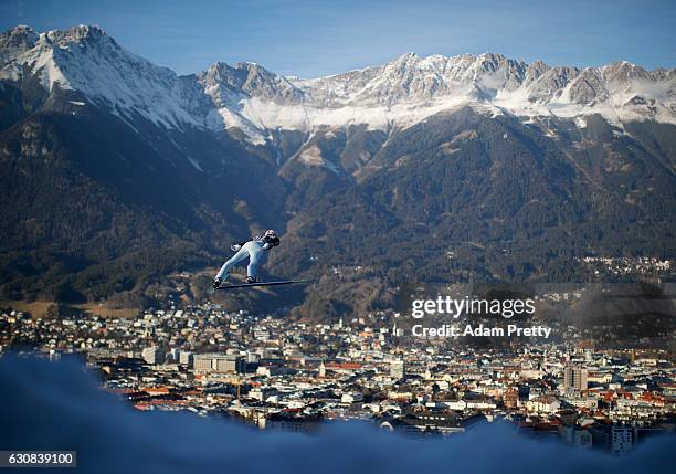 Severin Freund of Germany soars through the air during his qualification jump on Day 1 of the 65th Four Hills Tournament ski jumping event on January...