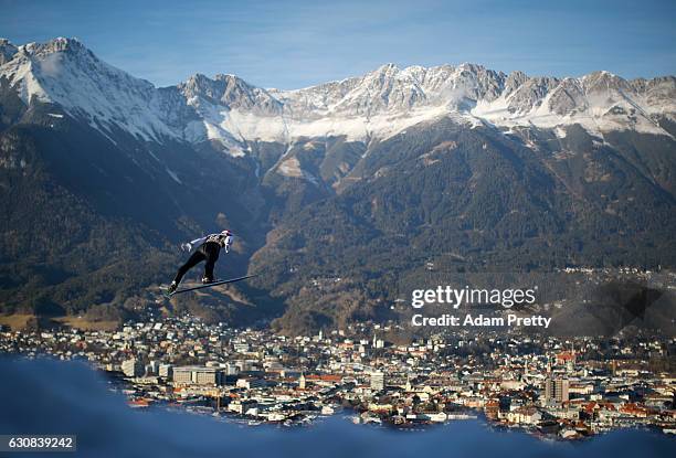 Markus Eisenbichler of Germany soars through the air during his qualification jump on Day 1 of the 65th Four Hills Tournament ski jumping event on...