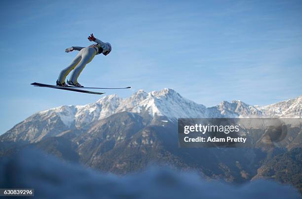 Daniel Andre Tande of Norway soars through the air during his qualification jump on Day 1 of the 65th Four Hills Tournament ski jumping event on...