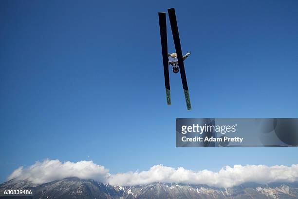 Denis Kornilov of Russia soars through the air during his qualification jump on Day 1 of the 65th Four Hills Tournament ski jumping event on January...