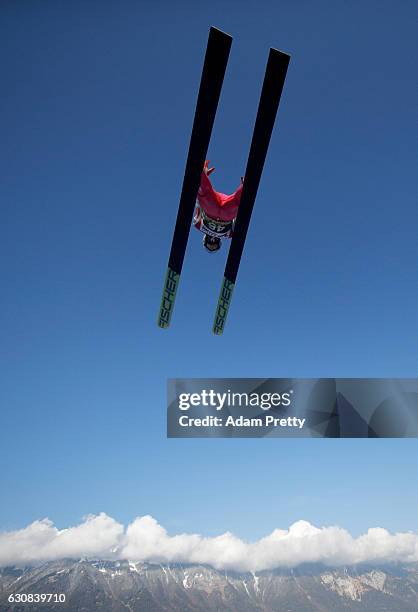 Anders Fannemel of Norway soars through the air during his qualification jump on Day 1 of the 65th Four Hills Tournament ski jumping event on January...