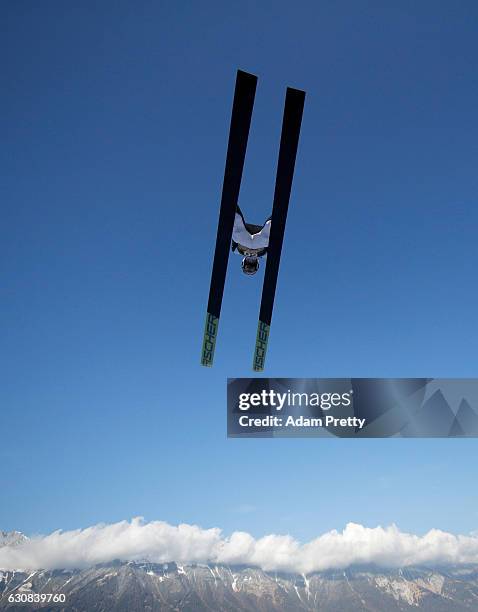 Evgeniy Klimov of Russia soars through the air during his qualification jump on Day 1 of the 65th Four Hills Tournament ski jumping event on January...