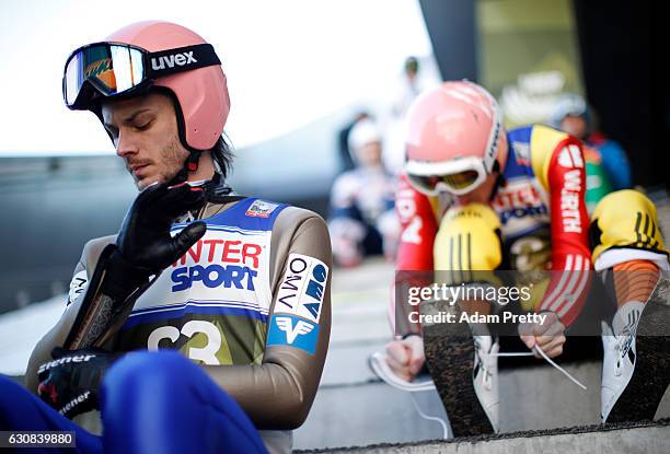 Manuel Fettner of Austria prepare for his qualification jump on Day 1 of the 65th Four Hills Tournament ski jumping event on January 3, 2017 in...