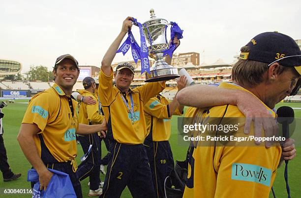 Hampshire captain Shaun Udal shows off the C&G trophy on a lap of honour with his team after Hampshire won the Cheltenham & Gloucester Trophy Final...