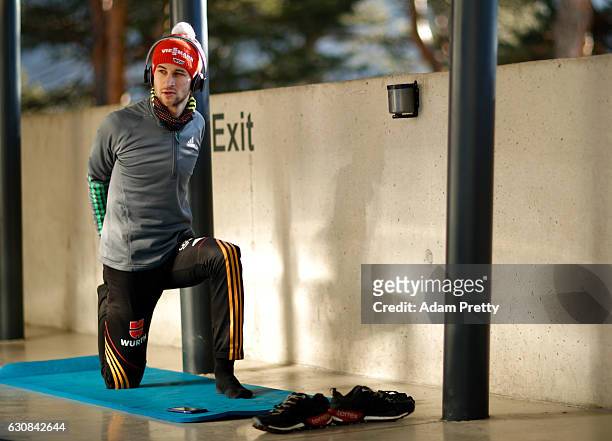 Markus Eisenbichler of Germany prepare for his qualification jump on Day 1 of the 65th Four Hills Tournament ski jumping event on January 3, 2017 in...