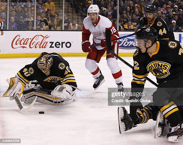 Boston Bruins goalie Tuukka Rask makes a save in front of Detroit Red Wings center Joakim Andersson during the second period. The Boston Bruins host...