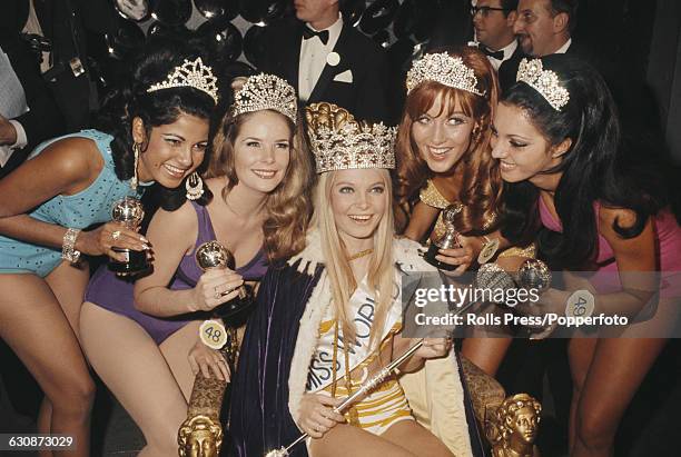 Winner of Miss World 1969 beauty pageant, Eva Rueber-Staier of Austria wears her crown and sits on the winnner's throne at the Royal Albert Hall in...