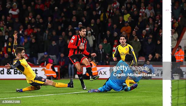 Charlie Daniels of AFC Bournemouth scores the opening goal past Petr Cech of Arsenal during the Premier League match between AFC Bournemouth and...