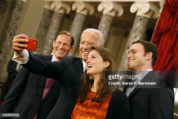 Vice President Joe Biden takes a selfie with Claire Blumenthal, daughter of U.S. Sen. Richard Blumenthal , following a reenacted swearing in ceremony...