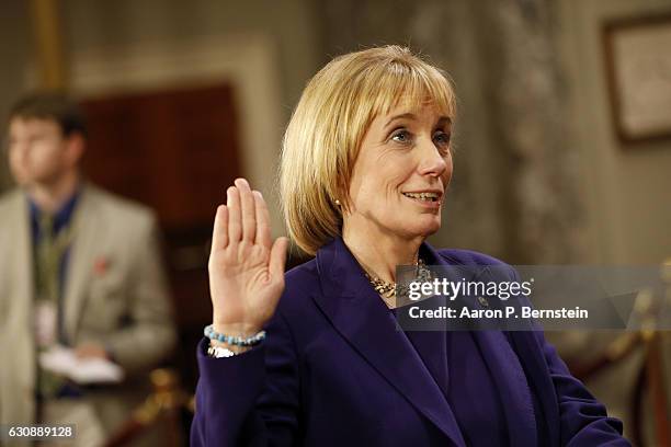 Sen. Maggie Hassan participates in a reenacted swearing-in with U.S. Vice President Joe Biden in the Old Senate Chamber at the U.S. Capitol January...