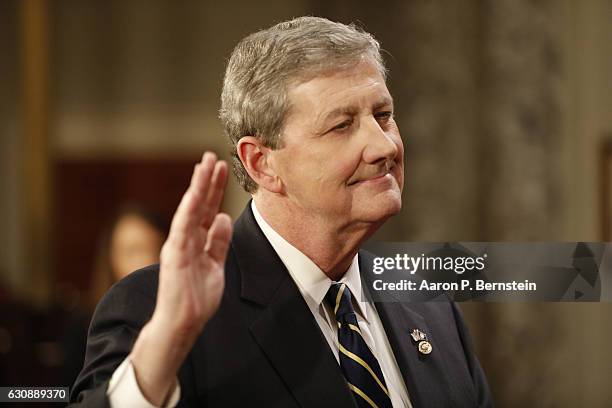 Sen. John Kennedy participates in a reenacted swearing-in with U.S. Vice President Joe Biden in the Old Senate Chamber at the U.S. Capitol January 3,...