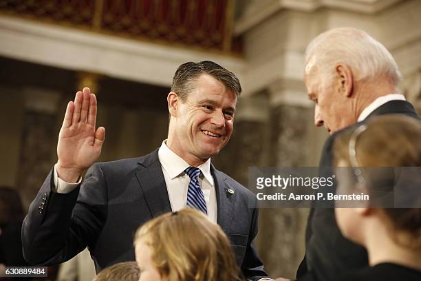 Sen. Todd Young participates in a reenacted swearing-in with U.S. Vice President Joe Biden in the Old Senate Chamber at the U.S. Capitol January 3,...