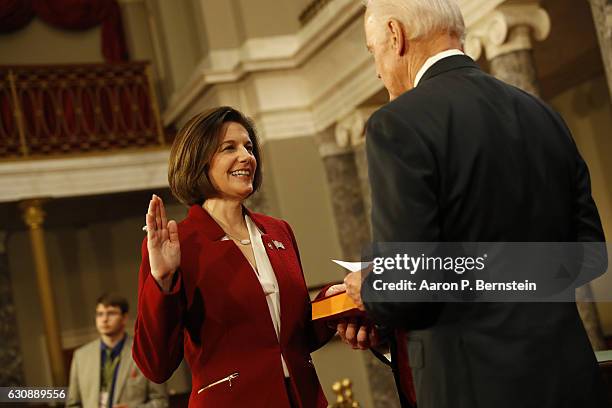 Sen. Catherine Cortez Masto participates in a reenacted swearing-in with U.S. Vice President Joe Biden in the Old Senate Chamber at the U.S. Capitol...