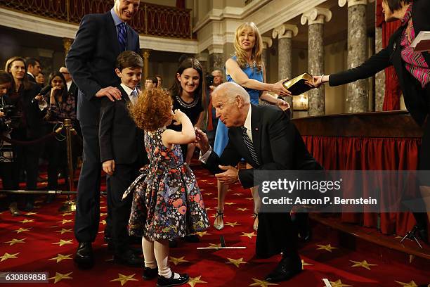 Vice President Joe Biden greets the children of U.S. Sen. Ron Wyden in the Old Senate Chamber at the U.S. Capitol January 3, 2017 in Washington, DC....