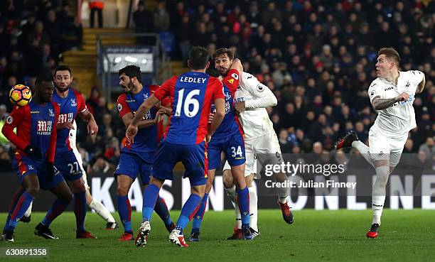 Alfie Mawson of Swansea City heads to score the opening goal during the Premier League match between Crystal Palace and Swansea City at Selhurst Park...