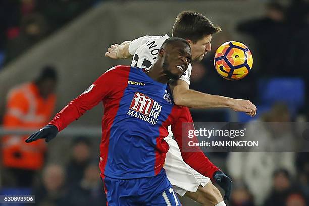 Crystal Palace's Zaire-born Belgian striker Christian Benteke vies with Swansea City's Argentinian defender Federico Fernandez during the English...