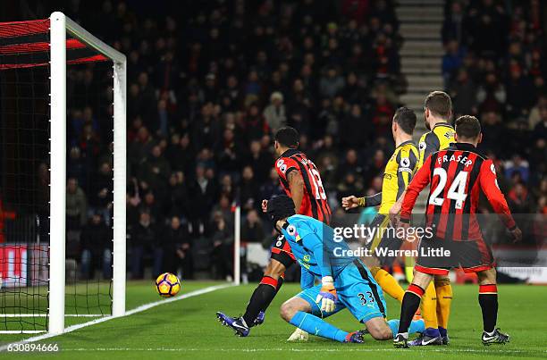 Ryan Fraser of AFC Bournemouth scores his team's third goal past Petr Cech of Arsenal during the Premier League match between AFC Bournemouth and...