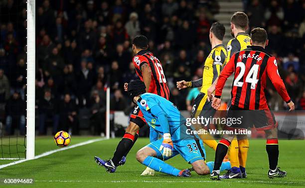 Ryan Fraser of AFC Bournemouth scores his team's third goal past Petr Cech of Arsenal during the Premier League match between AFC Bournemouth and...