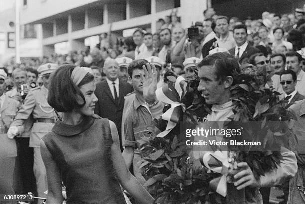 Scottish racing driver Jackie Stewart with his wife, Helen, after he won the Monaco Grand Prix in a BRM P261, Monte Carlo, 22nd May 1966.
