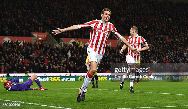 Peter Crouch of Stoke City celebrates scoring his team's second goal during the Premier League match between Stoke City and Watford at Bet365 Stadium...