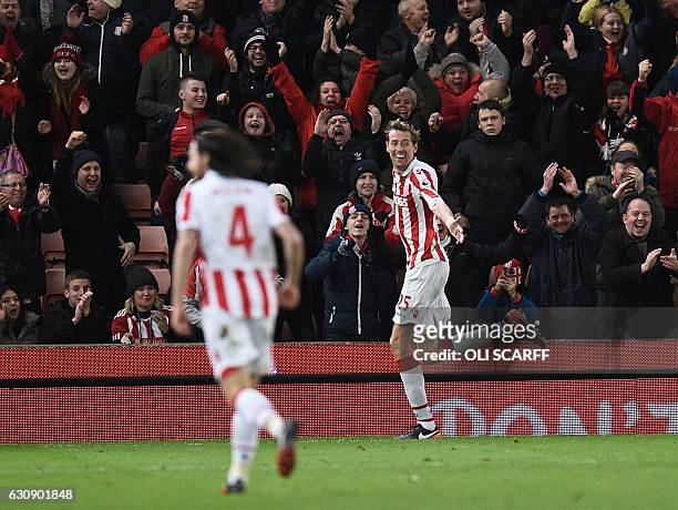 Stoke City's English striker Peter Crouch celebrates after scoring their second goal during the English Premier League football match between Stoke...