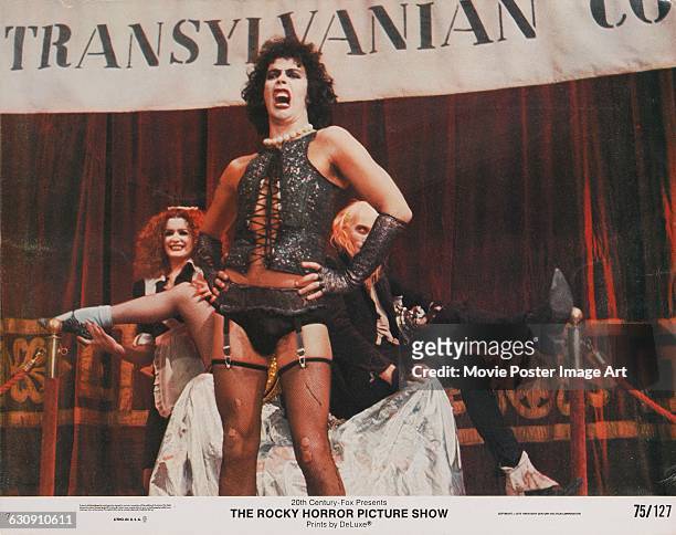 From right to left, actors Richard O'Brien, Tim Curry and Patricia Quinn as Riff Raff, Dr Frank-N-Furter and Magenta respectively, on a lobby card...