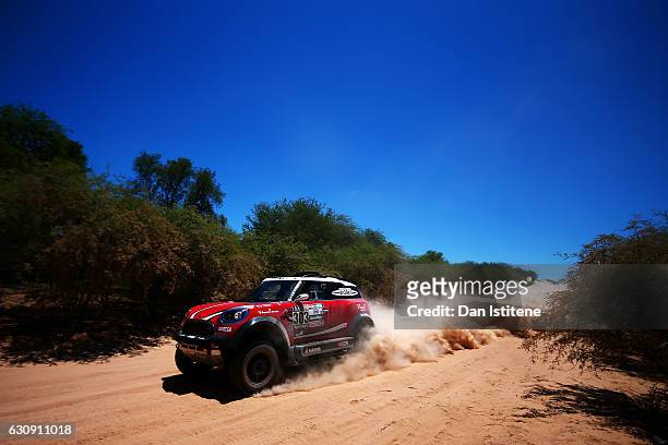 Mikko Hirvonen of Finland and Mini X-Raid drives with co-driver Michel Perin of France in the John Cooper Works Rally Mini car in the Classe : T1.2 :...